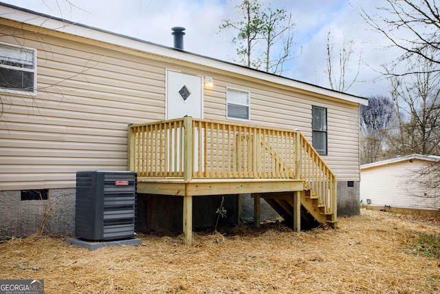 back of property featuring crawl space, stairway, a wooden deck, and central air condition unit