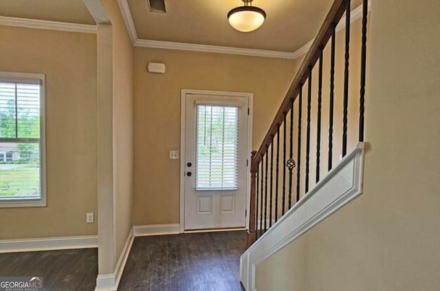 entrance foyer with baseboards, wood finished floors, stairs, and crown molding