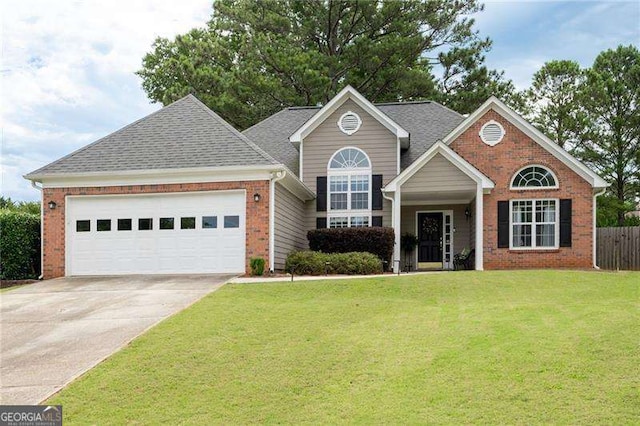 view of front facade featuring brick siding, a shingled roof, concrete driveway, a front yard, and a garage