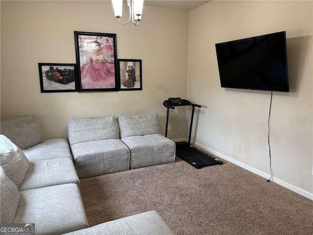 living area with carpet floors, baseboards, and a chandelier