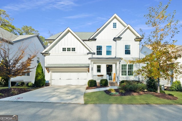 view of front of house with board and batten siding, concrete driveway, and a garage