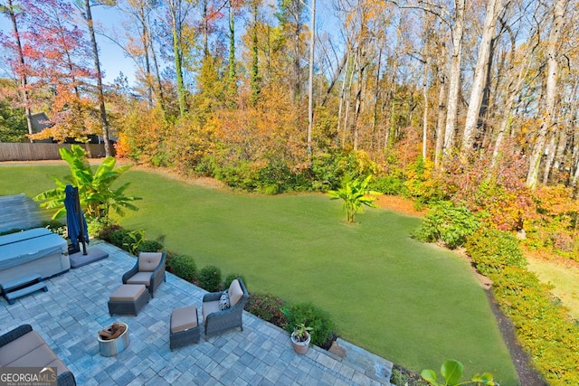 view of yard featuring fence and a patio