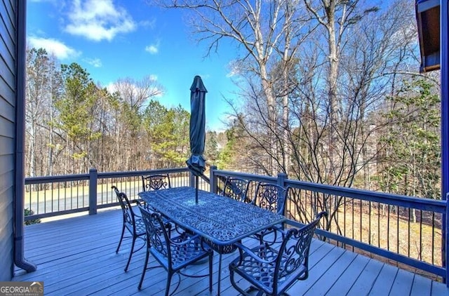 deck featuring outdoor dining area