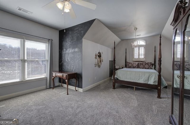 bedroom featuring visible vents, carpet flooring, vaulted ceiling, ceiling fan, and baseboards