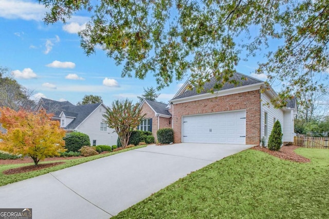 view of front facade with an attached garage, brick siding, fence, concrete driveway, and a front yard