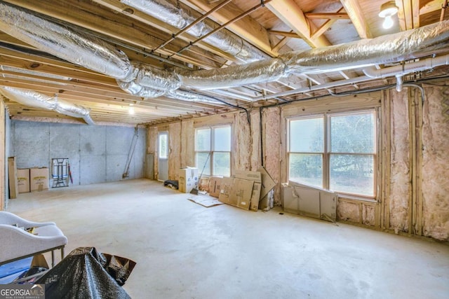 misc room featuring unfinished concrete flooring