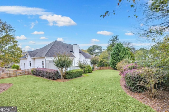 view of yard with a fenced backyard