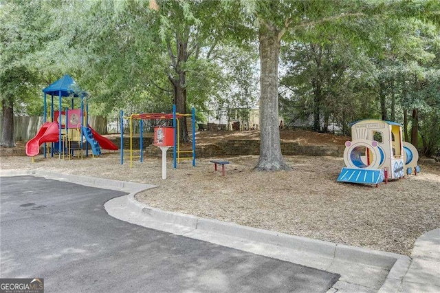 communal playground featuring fence