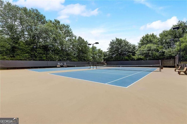 view of sport court with fence