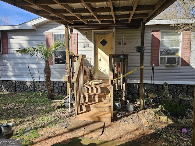 view of exterior entry featuring cooling unit