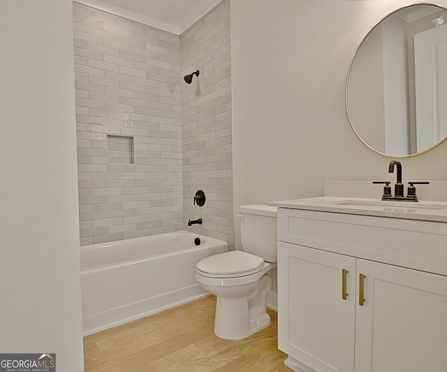 full bath with toilet, vanity, shower / bathtub combination, and wood finished floors