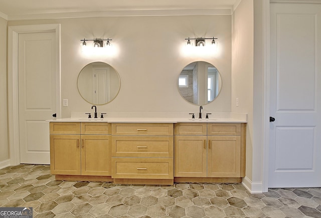 bathroom with crown molding, a sink, and double vanity