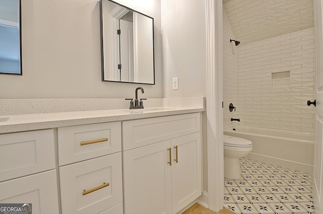 bathroom featuring toilet, vanity, and washtub / shower combination