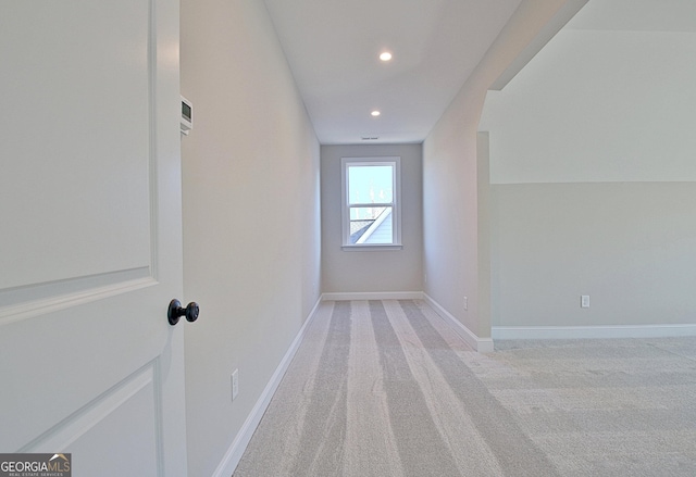 bonus room with recessed lighting, light carpet, and baseboards