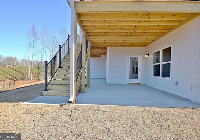 entrance to property with a patio area