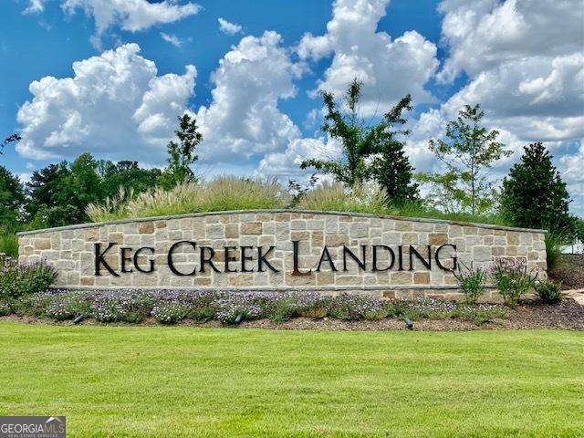 community / neighborhood sign with a lawn