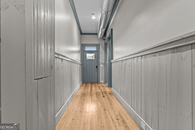 corridor with wood-type flooring