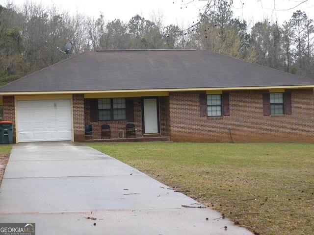 single story home featuring brick siding, a shingled roof, an attached garage, driveway, and a front lawn