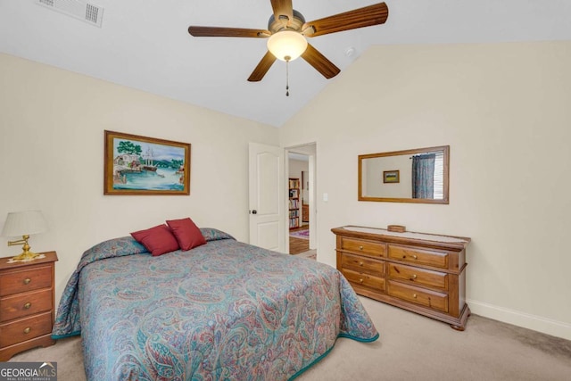 bedroom featuring light colored carpet, visible vents, a ceiling fan, vaulted ceiling, and baseboards