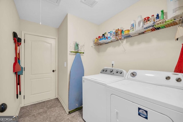 clothes washing area with visible vents, attic access, laundry area, independent washer and dryer, and baseboards