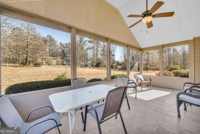 sunroom with vaulted ceiling, ceiling fan, and a wealth of natural light