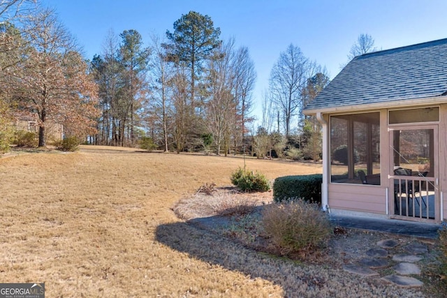 view of yard with a sunroom