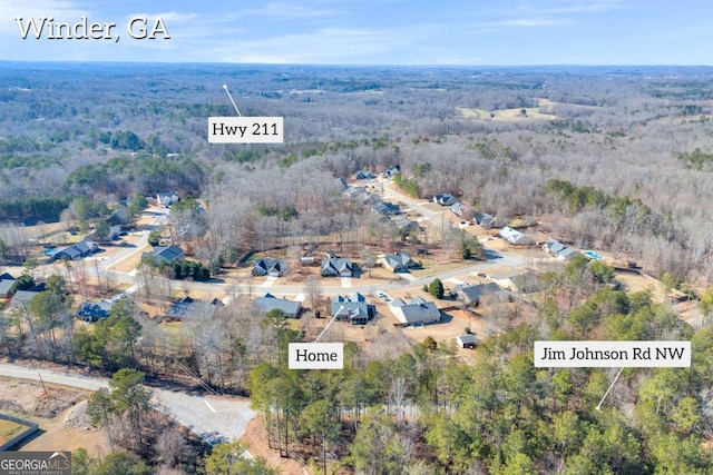 bird's eye view featuring a residential view and a view of trees