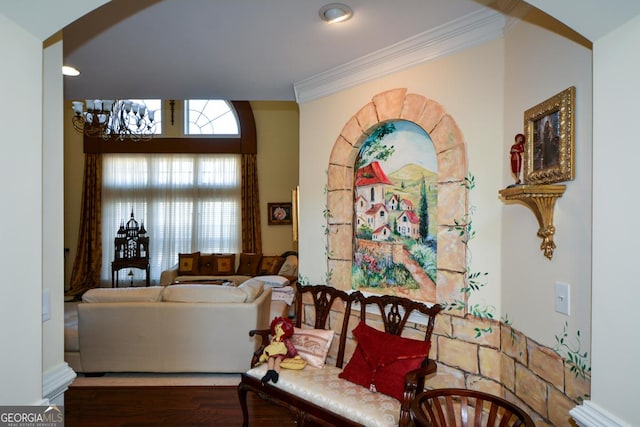 interior space with ornamental molding and wood finished floors