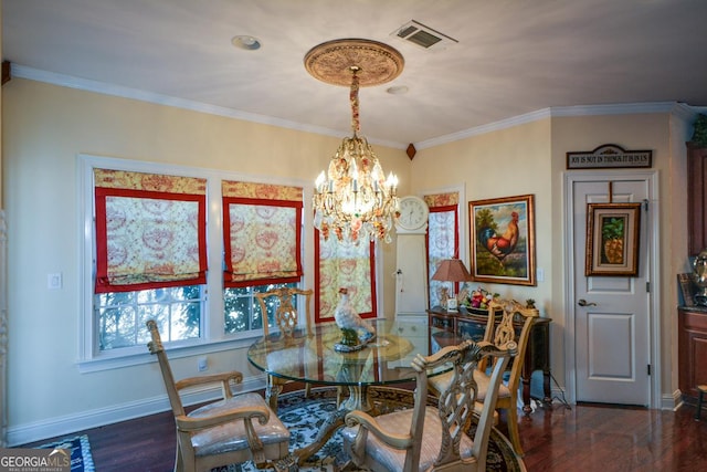 dining room featuring baseboards, visible vents, dark wood-type flooring, crown molding, and a notable chandelier