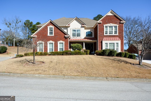 traditional home featuring brick siding