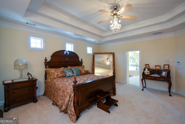 bedroom featuring light carpet, visible vents, a tray ceiling, and baseboards