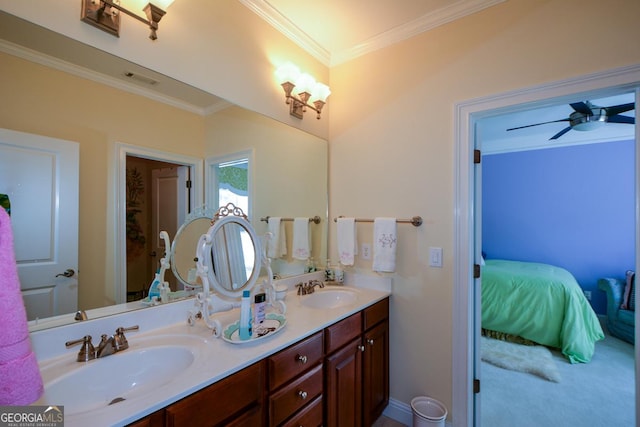 full bathroom with double vanity, crown molding, a ceiling fan, and a sink