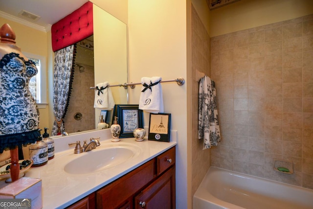 bathroom featuring ornamental molding, visible vents, shower / bath combination with curtain, and vanity