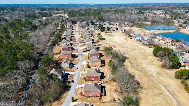 bird's eye view with a residential view and a water view