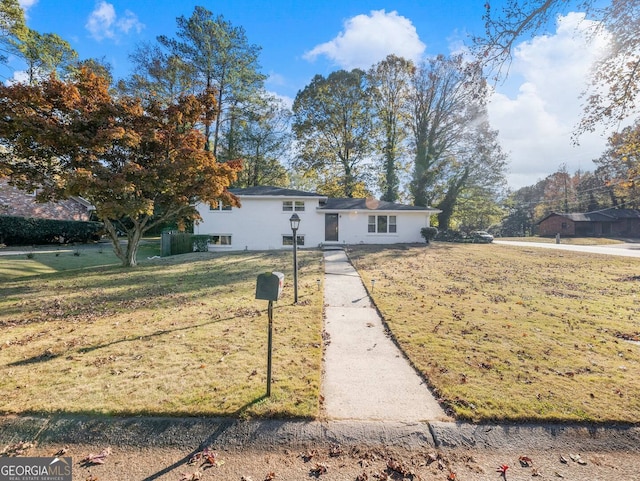 ranch-style house with a front yard