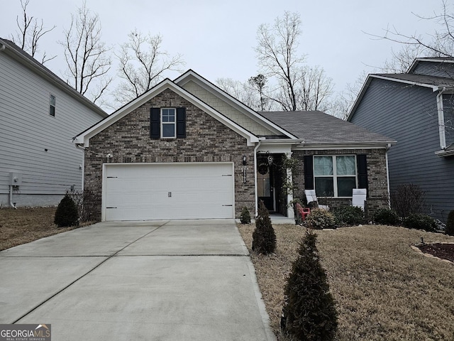 craftsman-style home featuring a garage, brick siding, and concrete driveway