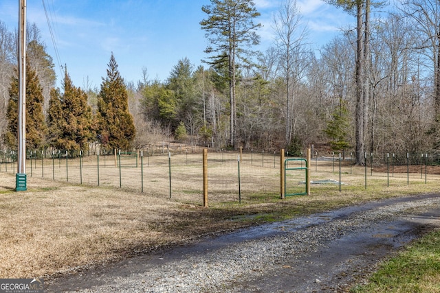 exterior space featuring a rural view and fence