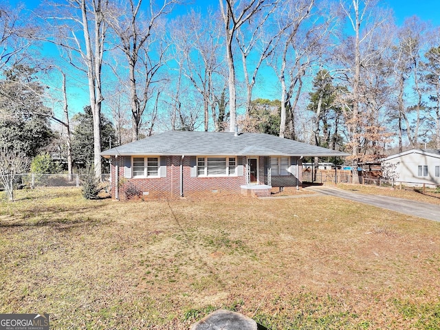 ranch-style home featuring aphalt driveway, brick siding, a front yard, crawl space, and fence