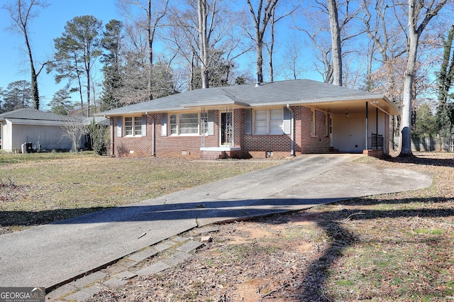 view of front facade with an attached carport, brick siding, concrete driveway, crawl space, and a front lawn