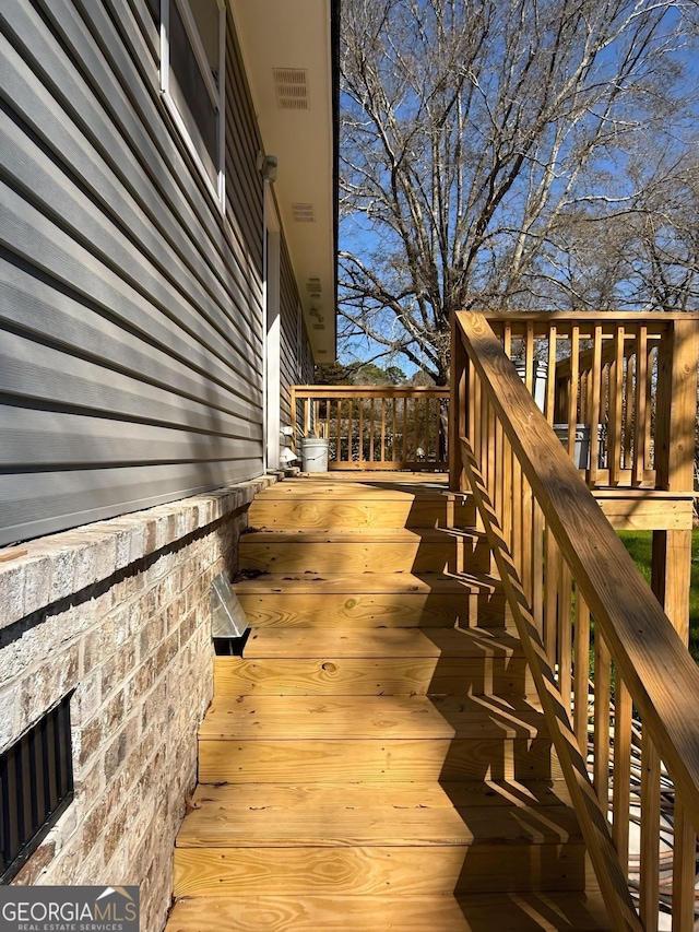 wooden terrace with stairs