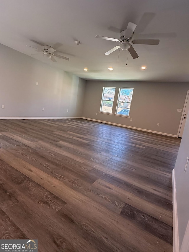 unfurnished room with dark wood-style floors, recessed lighting, baseboards, and a ceiling fan