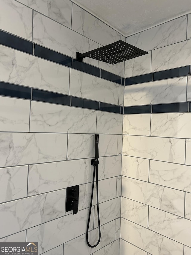 room details with a tile shower