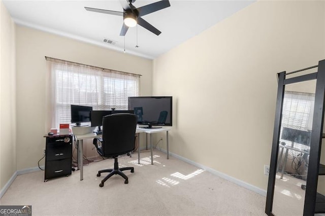 home office featuring ceiling fan, carpet flooring, visible vents, and baseboards