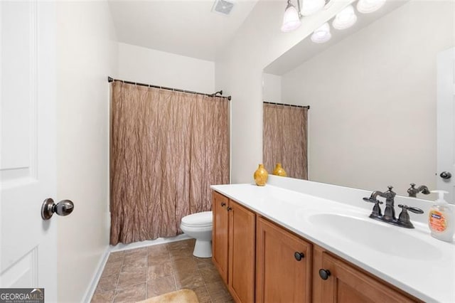 full bathroom featuring toilet, vanity, visible vents, and a shower with curtain