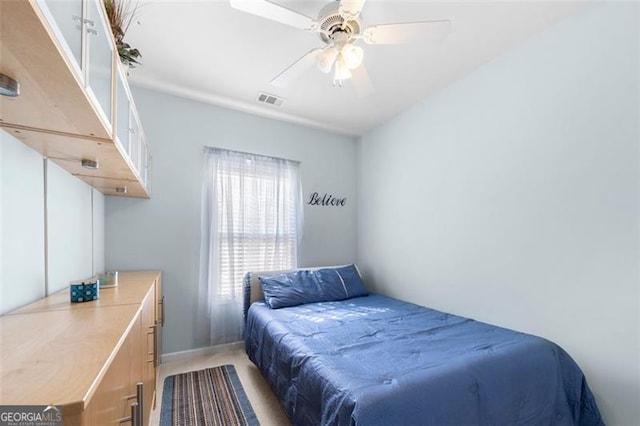 bedroom featuring visible vents and ceiling fan