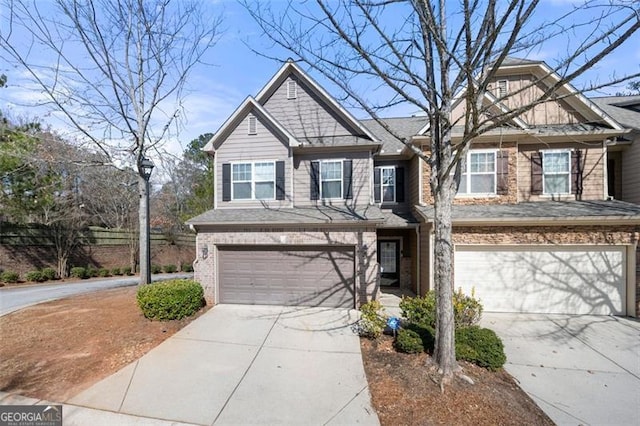 view of front of house featuring a garage, brick siding, and driveway