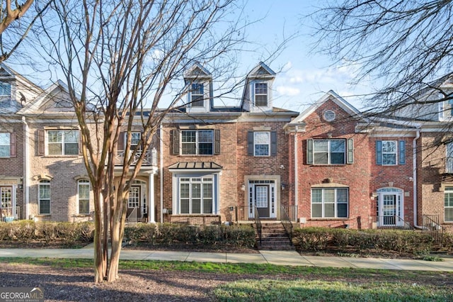 view of front of home with brick siding