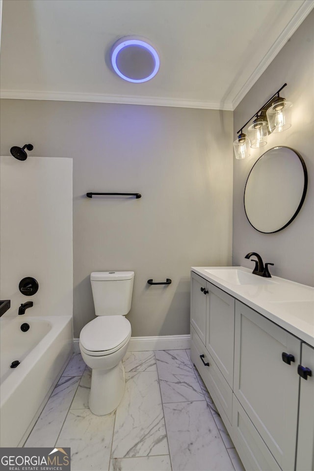 bathroom with toilet, marble finish floor, baseboards, and ornamental molding