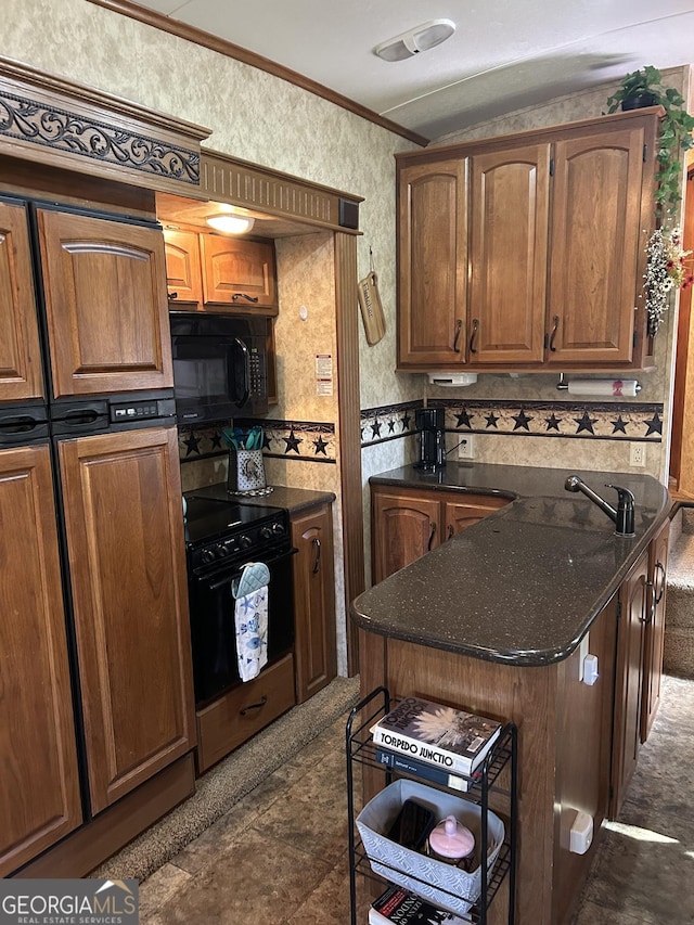 kitchen with ornamental molding, brown cabinetry, a kitchen island, black appliances, and wallpapered walls