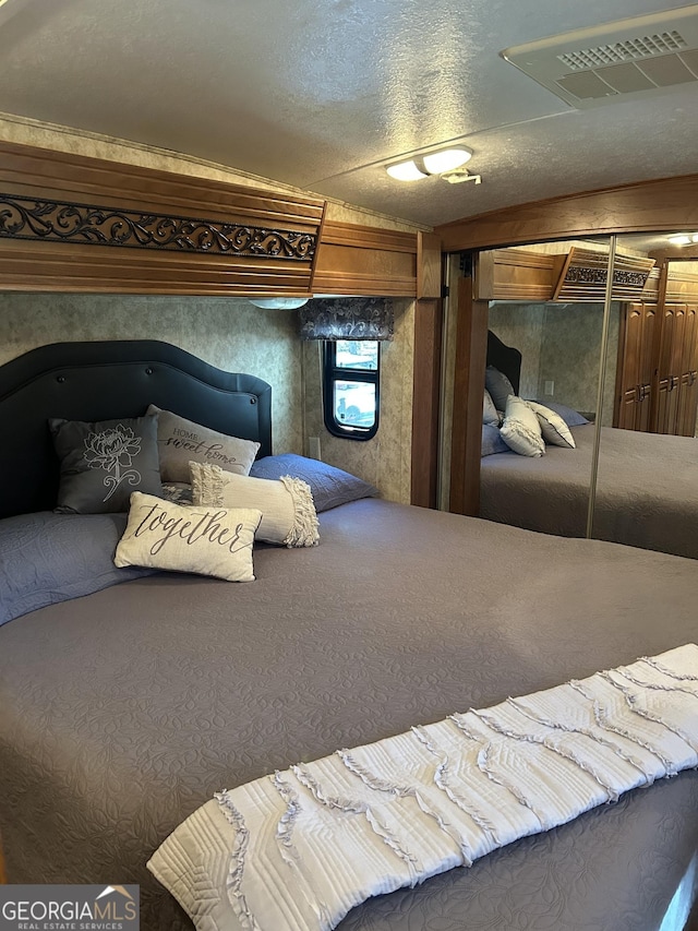 bedroom featuring visible vents